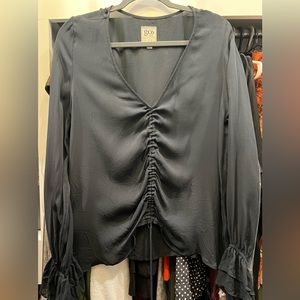 EUC GoSilk black silk top with front, high-low detail and ruffle sleeves sz L